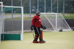 A player from Poole Hockey Club in goal